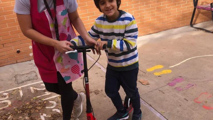 Boy on a scooter. AUTRADE.